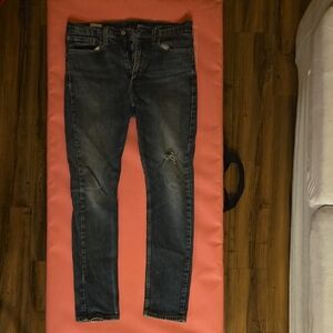 Levi's Classic Blue Denim Jeans. Rips and wear by Natural Causation.